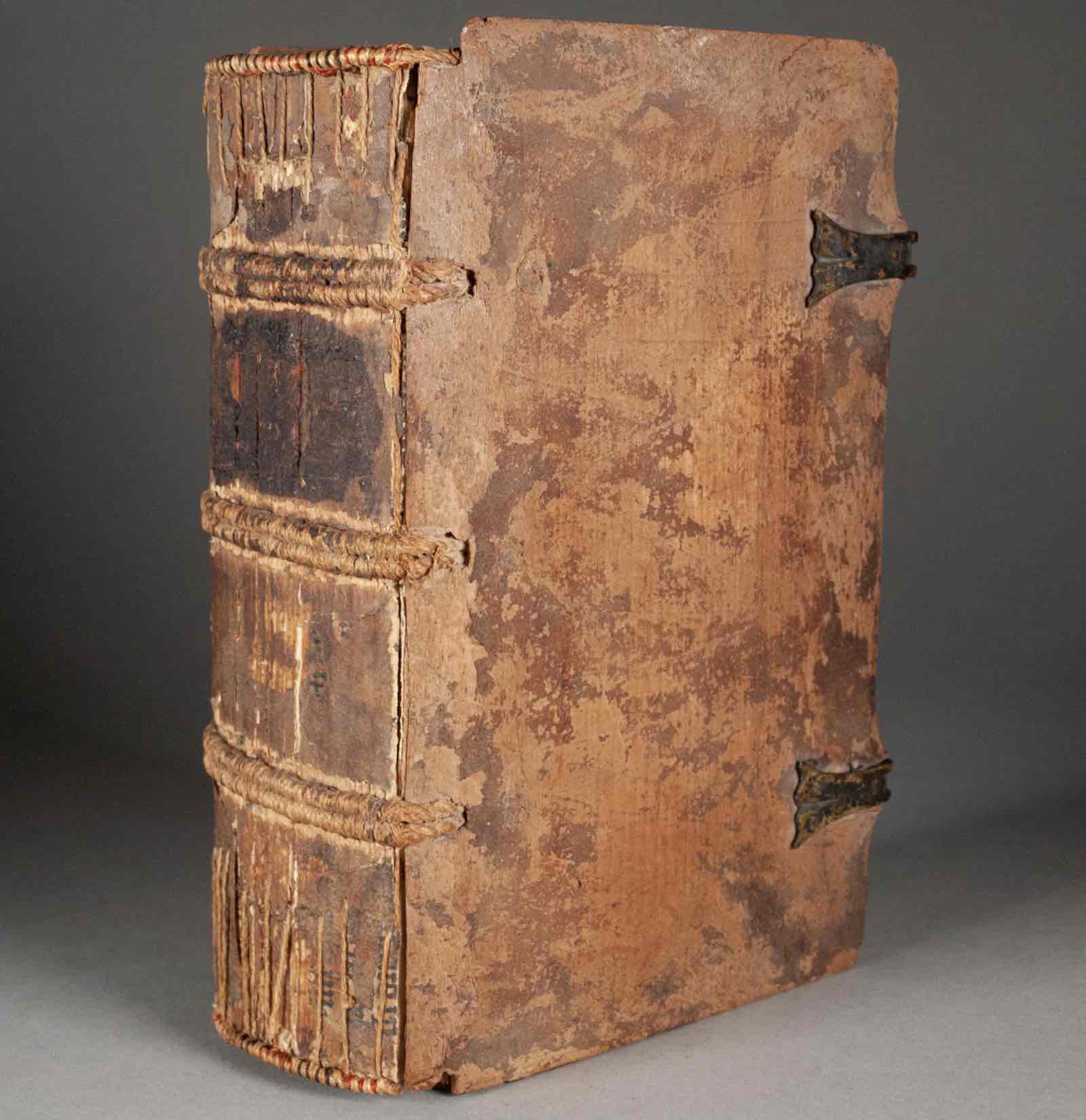 Olson Rare Books: Sermones quadragesimales de peccatis by Robertus Caracciolus. Strassburg: Johann Prüss, December 3, 1490.  Bound using fragments of Ars Minor by Aelius Donatus. Mainz, owner of the type of the 42-Line Bible, ca. 1454-1457.  A fantastically rare Donatus fragment printed on parchment with the type of the Gutenberg Bible. It has characteristics of the earliest editions and plausibly predates the Bible’s publication. All examples survive exclusively as fragments from bindings. The last time o